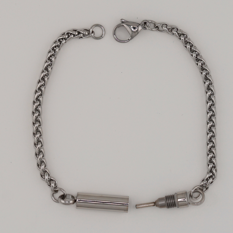 Captive Collars®️ Hidden Key Bracelet — your discreet symbol of control
