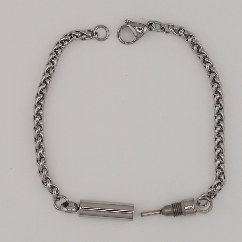 Captive Collars®️ Hidden Key Bracelet — your discreet symbol of control