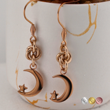 Moon with Star Earrings Dangling from Lovers O Knot