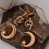 Moon with Star Earrings Dangling from Lovers O Knot